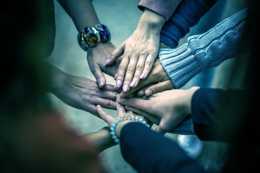 community hands in a circle